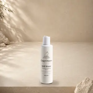 CapyOnsen Micellar Cleansing Water, Still Water, 200ml bottle styled on a sunlit stone surface