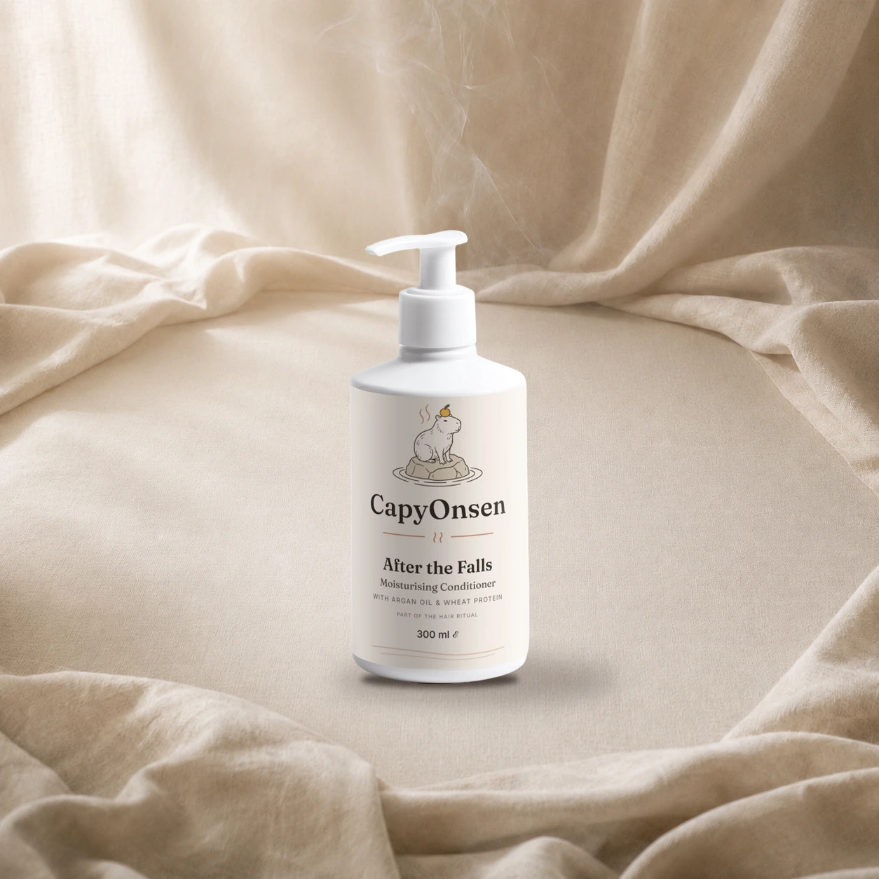 CapyOnsen Moisturising Conditioner, After the Falls, 290ml pump bottle styled on draped linen