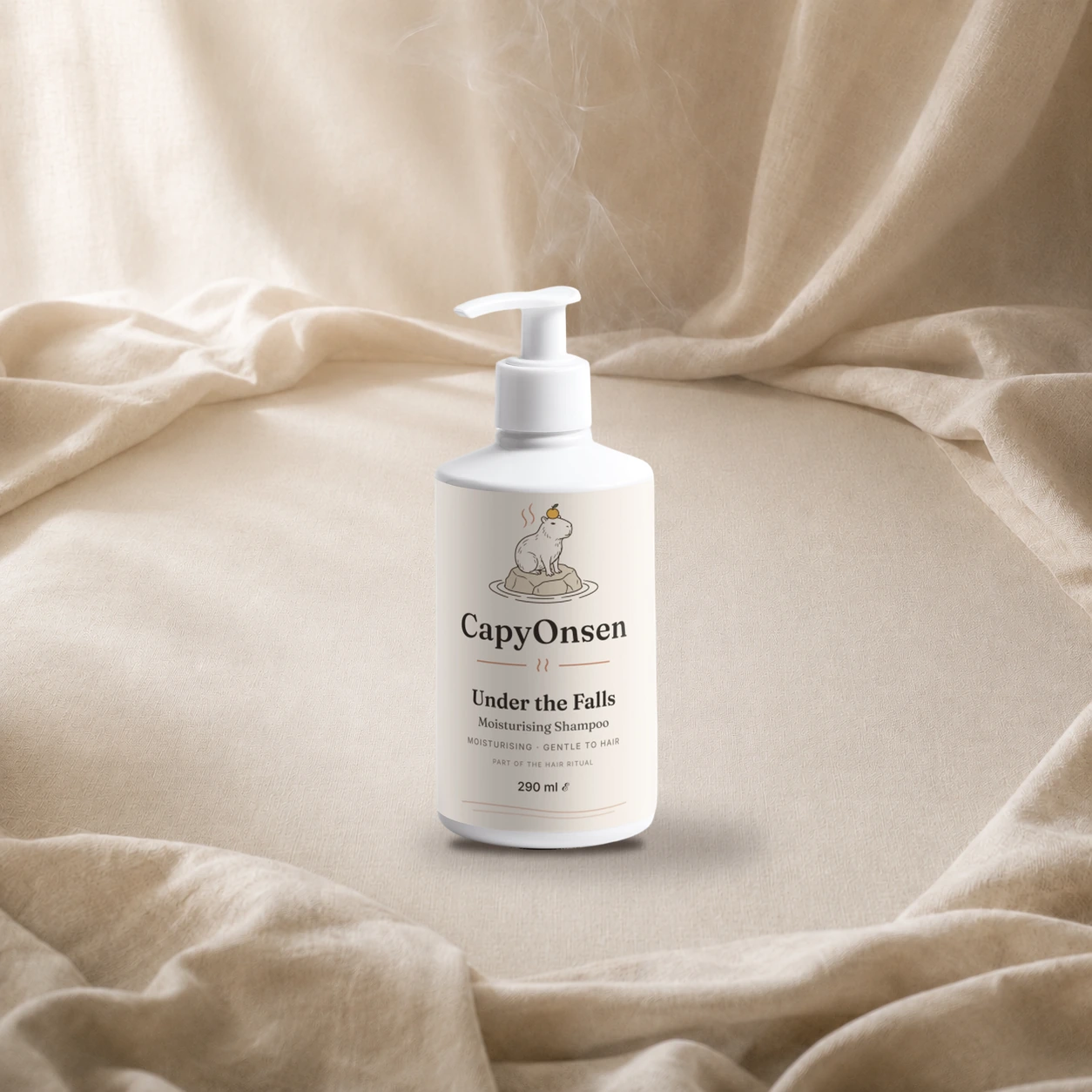 CapyOnsen Moisturising Shampoo, Under the Falls, 290ml pump bottle styled on draped linen
